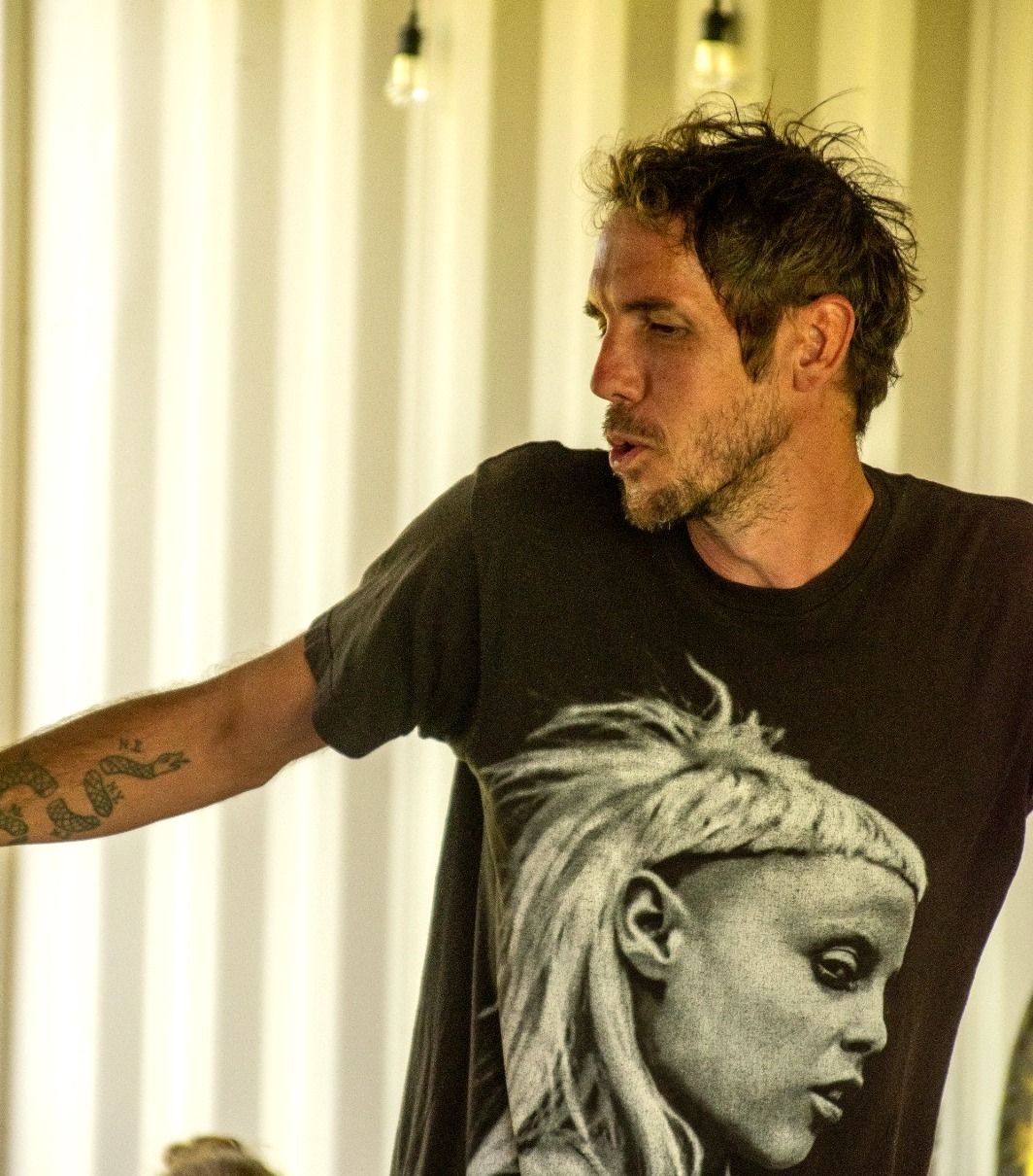 Professor Gray Balls head faced in profile while wearing a t-shirt of Yolandi's face in profile.